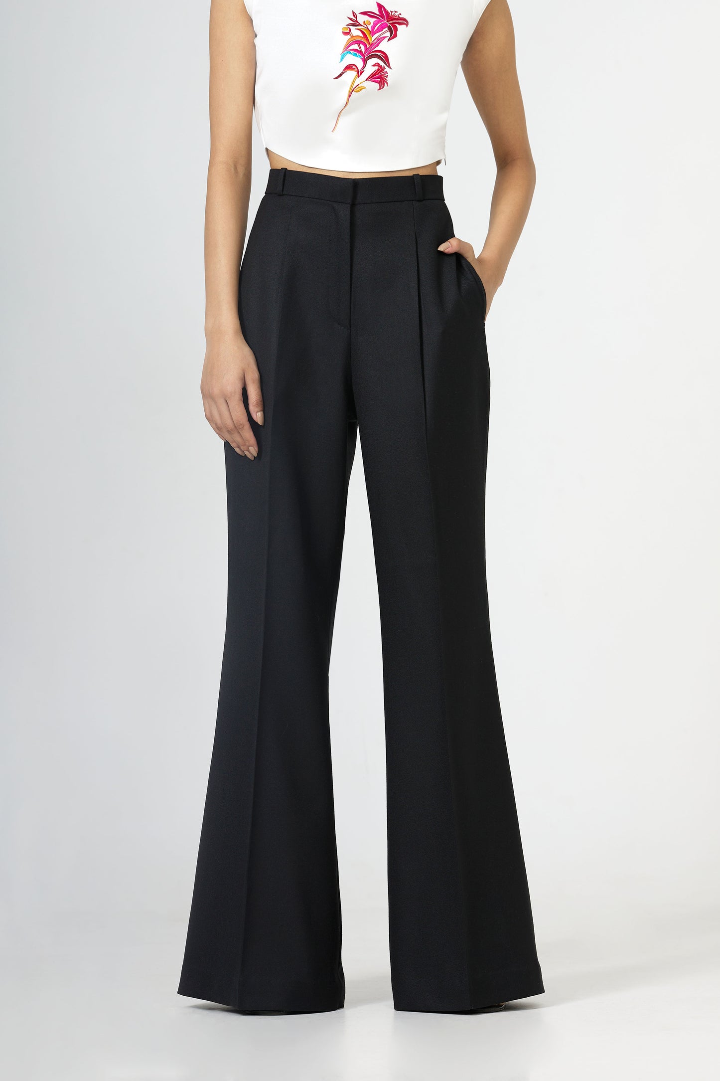 black front-pleated flared trousers
