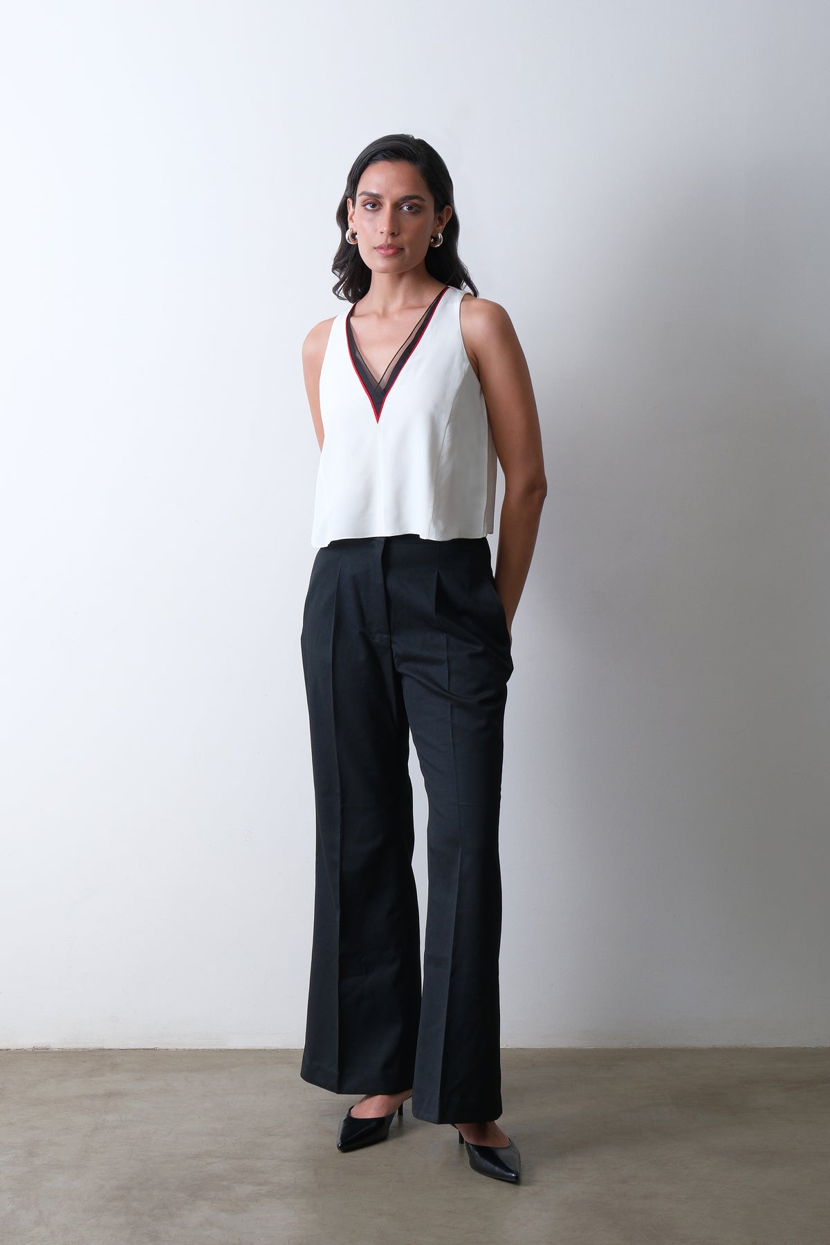 Ivory silk crepe top with organza neckline and red piping detail