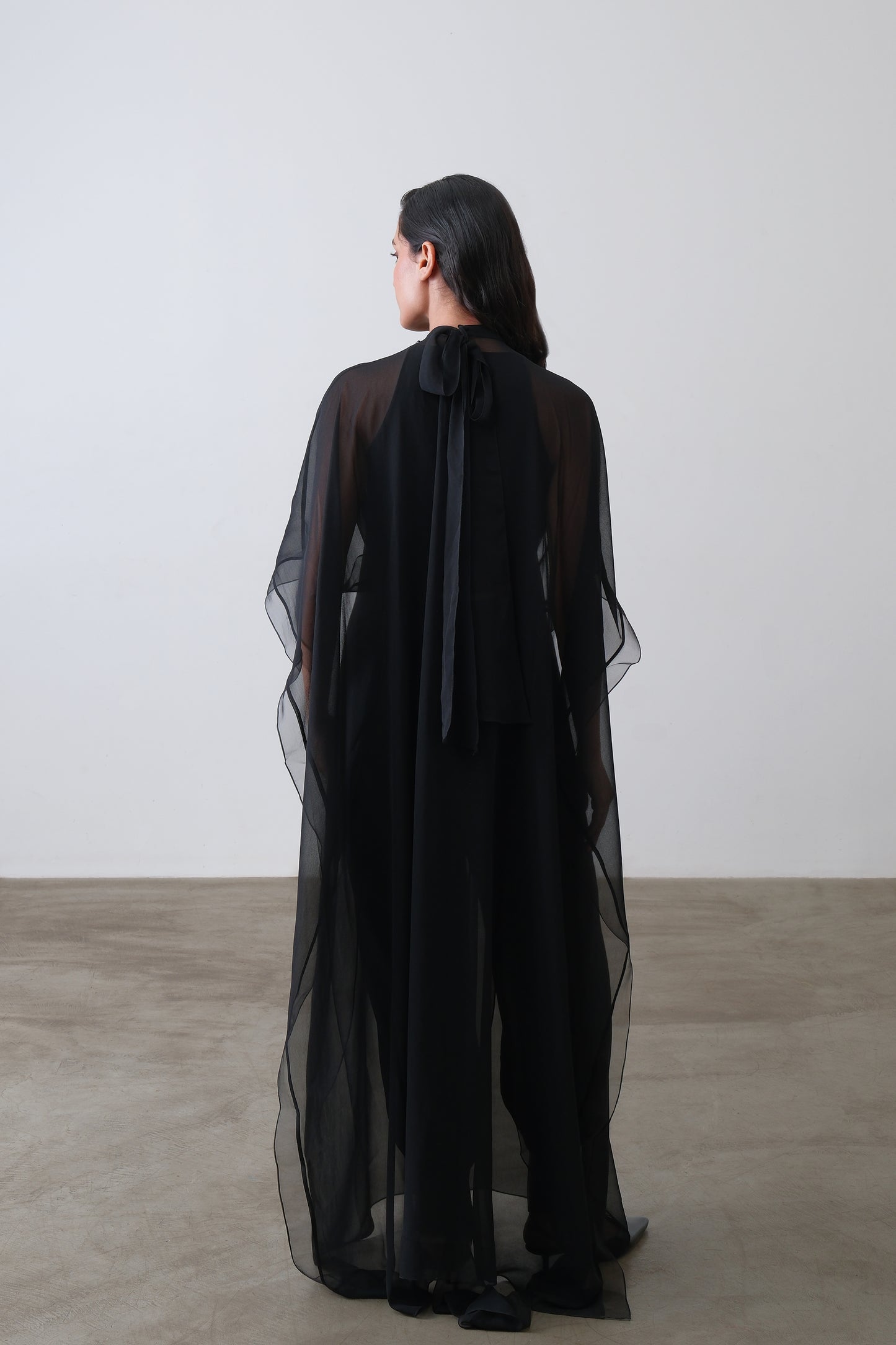 Black georgette cape, back view with open back and neck tie closure