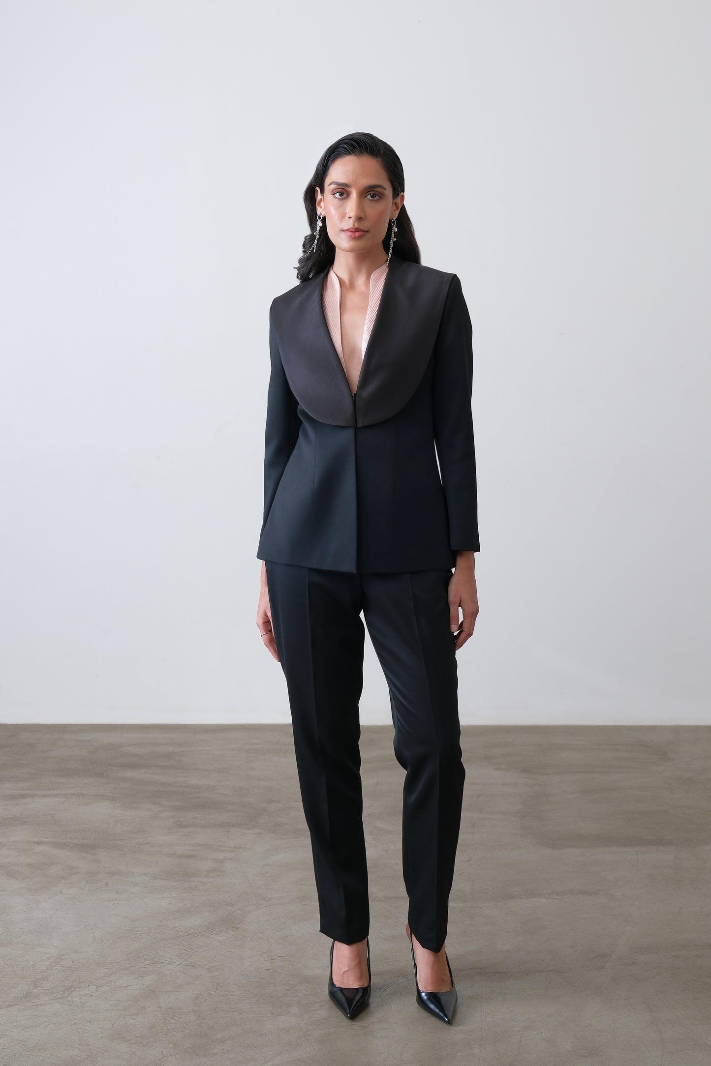 Black poly viscose blend blazer with exaggerated satin collar and sculpted fit
