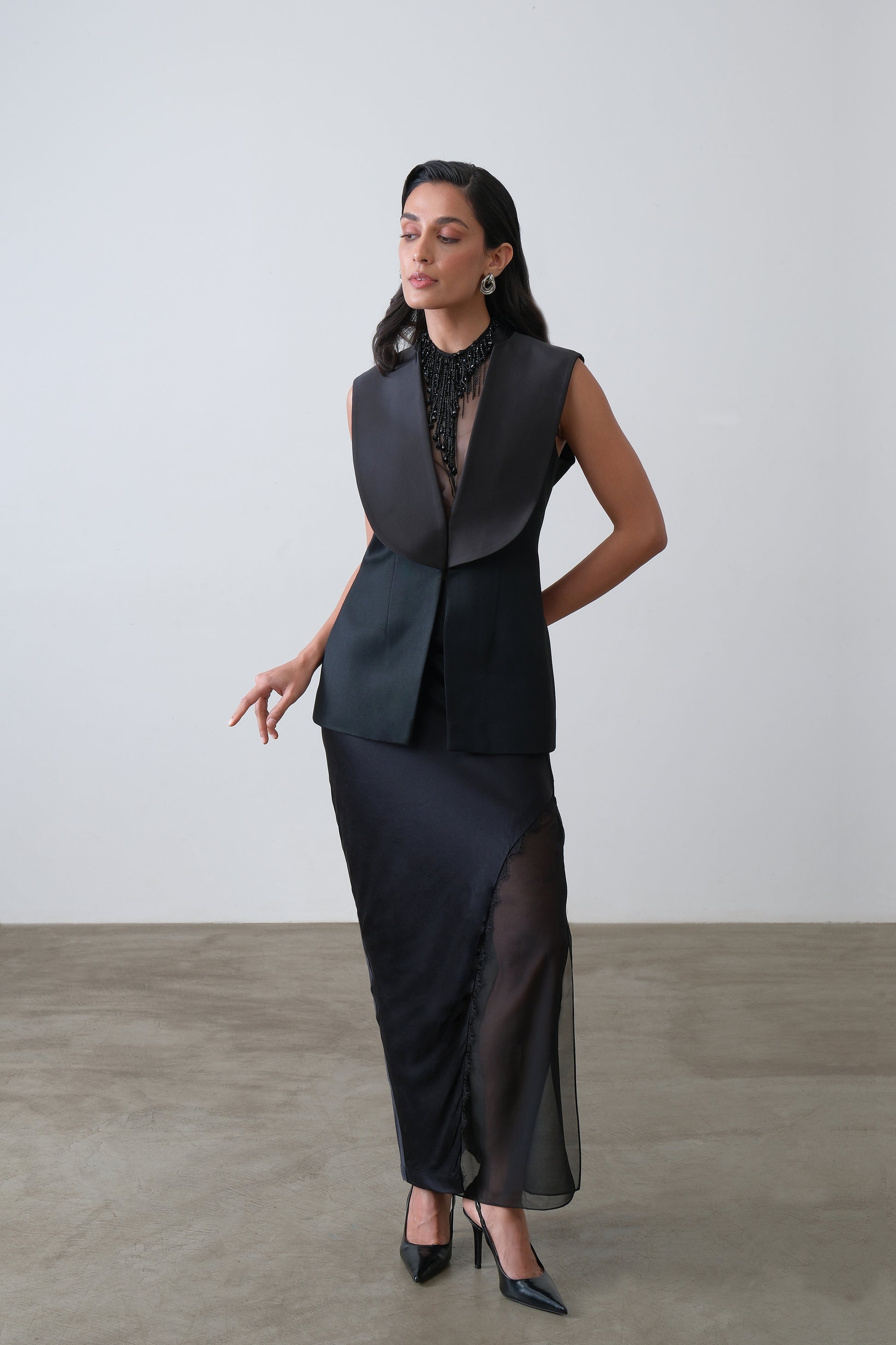 Black silk satin and georgette two piece skirt with asymmetric overlay and lace detail