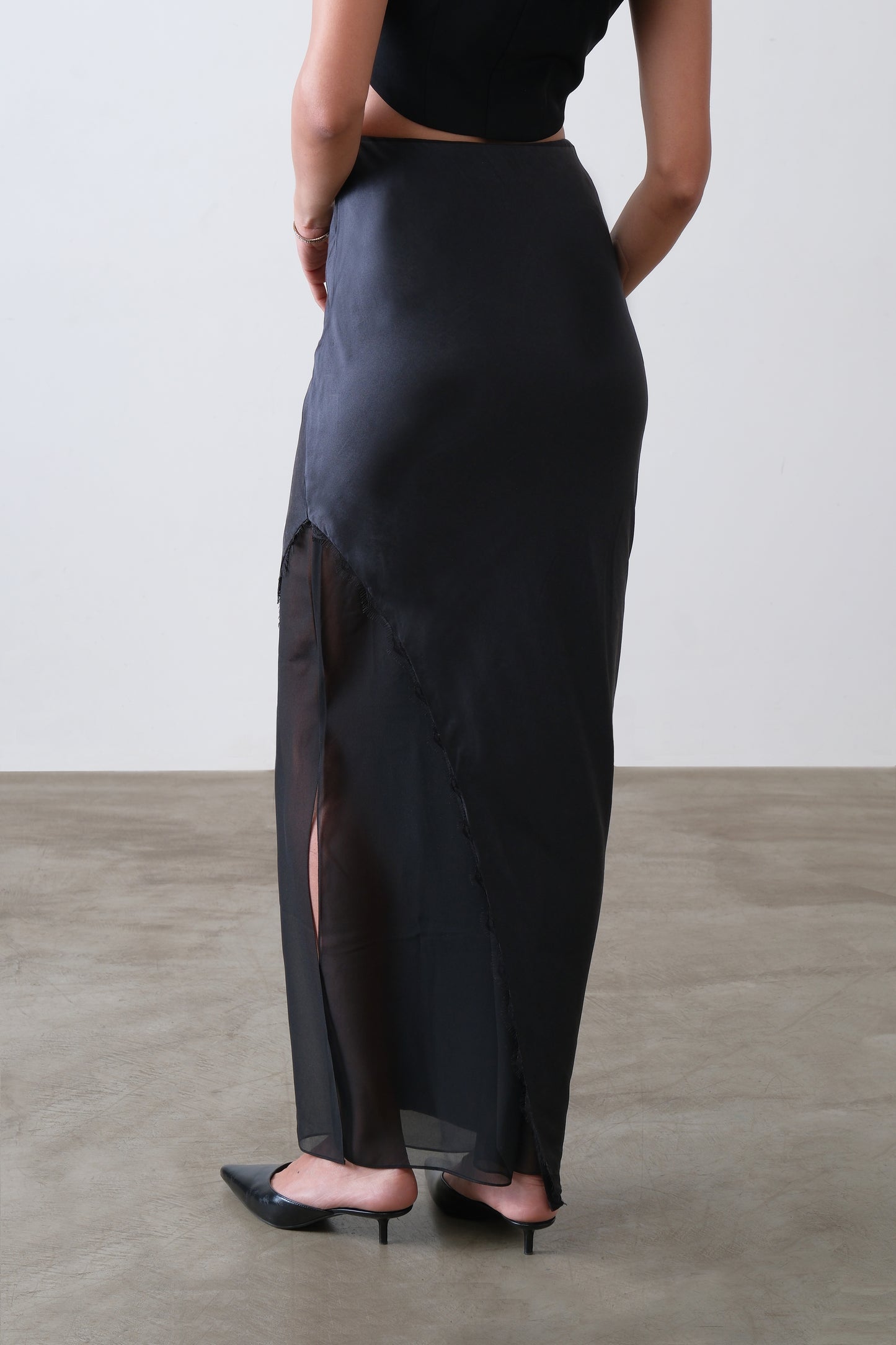Black silk satin and georgette skirt, back view with asymmetric overlay and lace detail