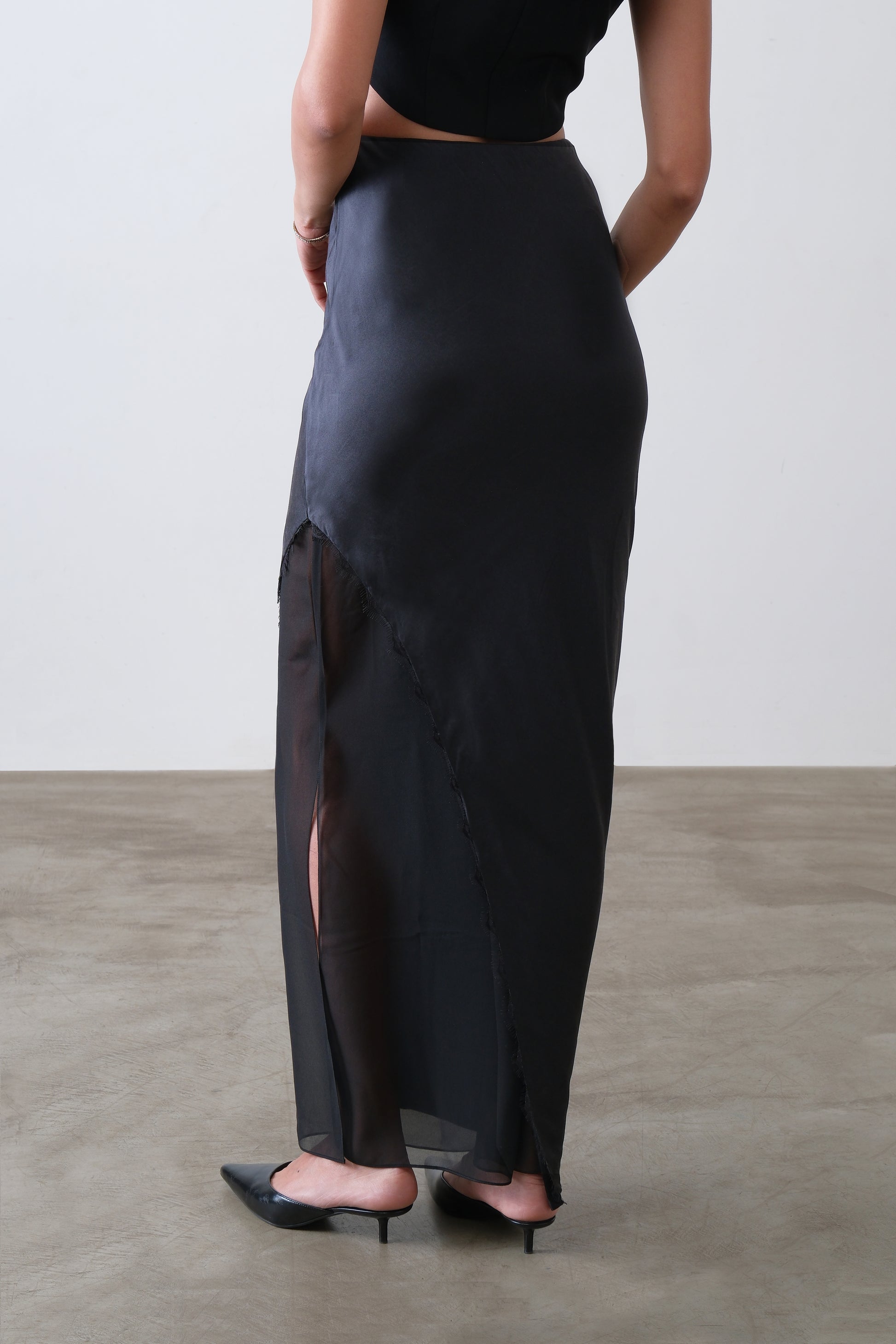 Black silk satin and georgette skirt, back view with asymmetric overlay and lace detail