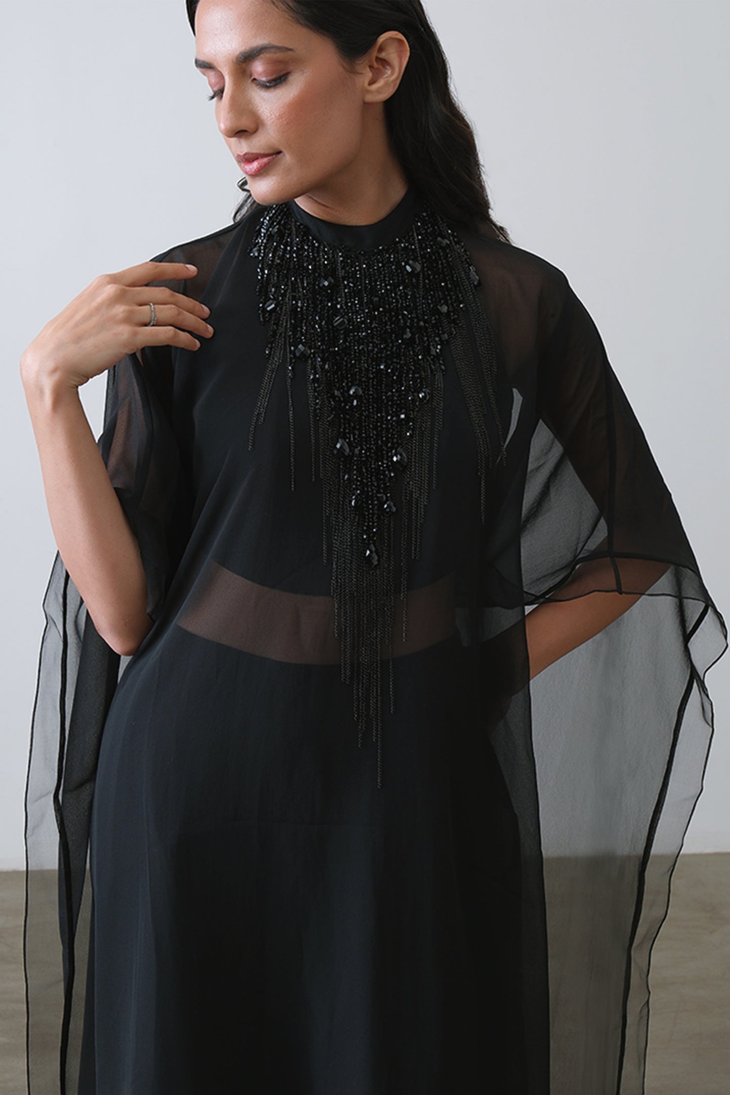 black embroidered cape