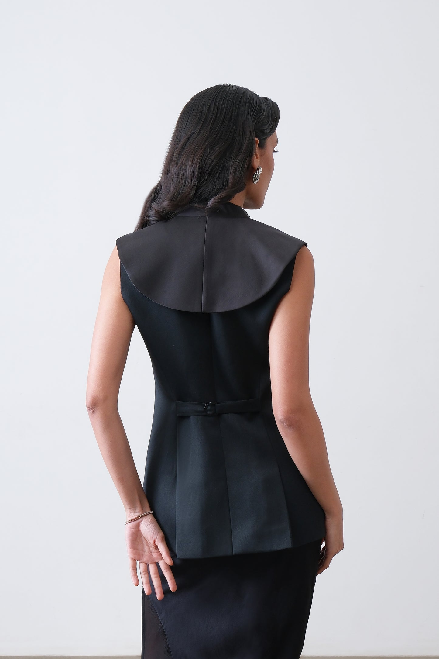 Black poly viscose blend waistcoat, back view with adjustable buckle
