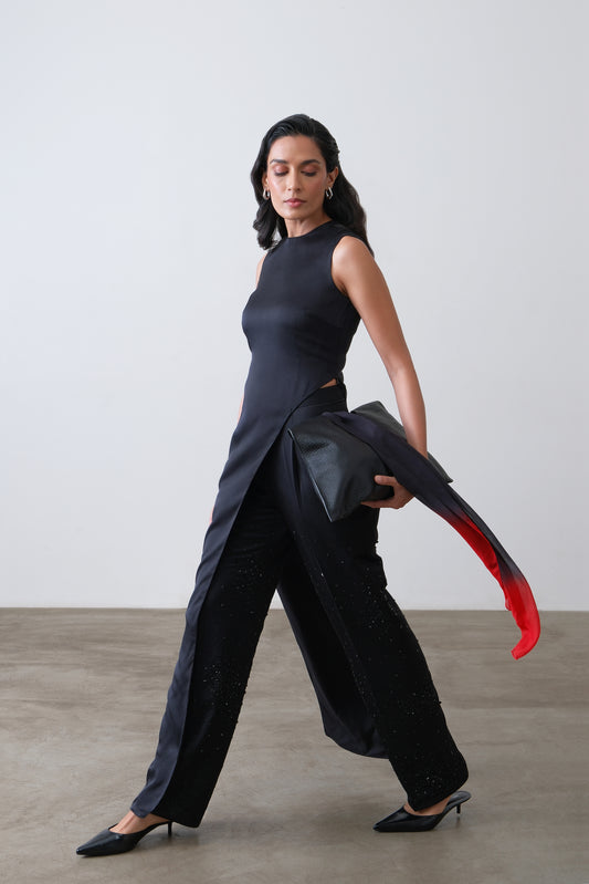 Side view of deep charcoal silk satin asymmetric top with long drape