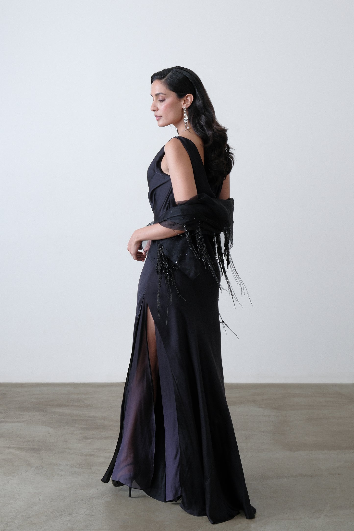 Charcoal silk satin georgette dress shown at a three quarter angle with cowl neck