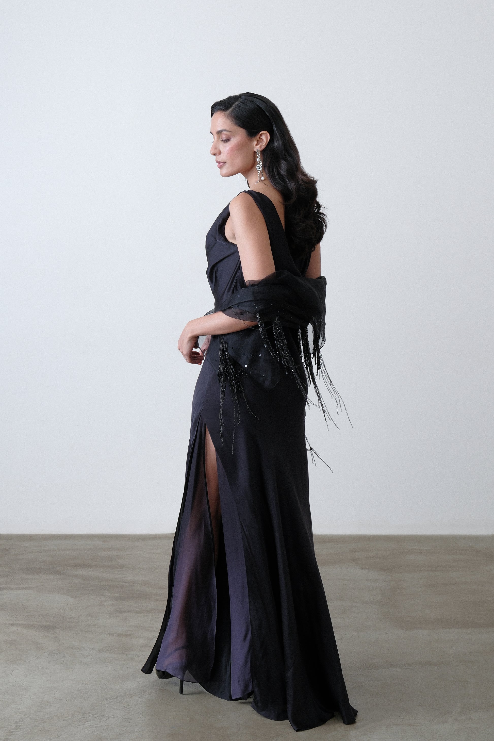 Charcoal silk satin georgette dress shown at a three quarter angle with cowl neck