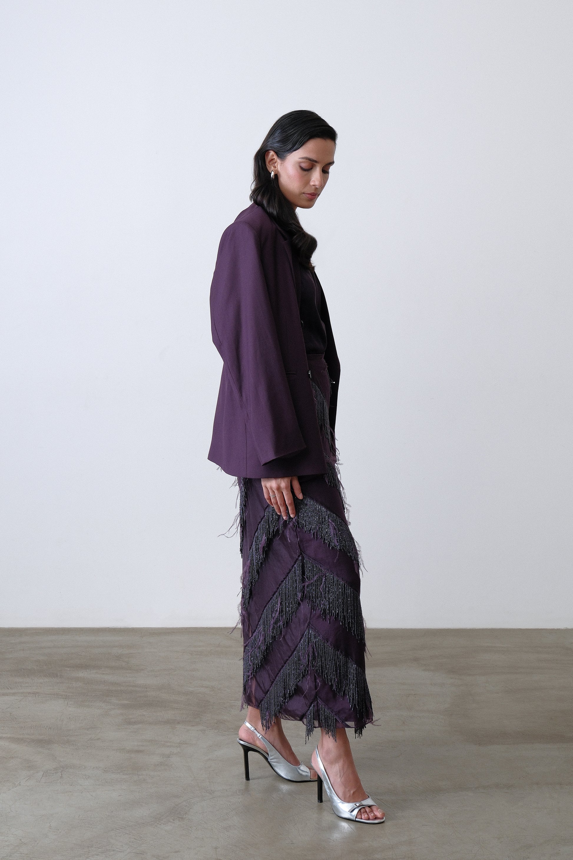 Side view of deep plum double breasted blazer with oversized silhouette
