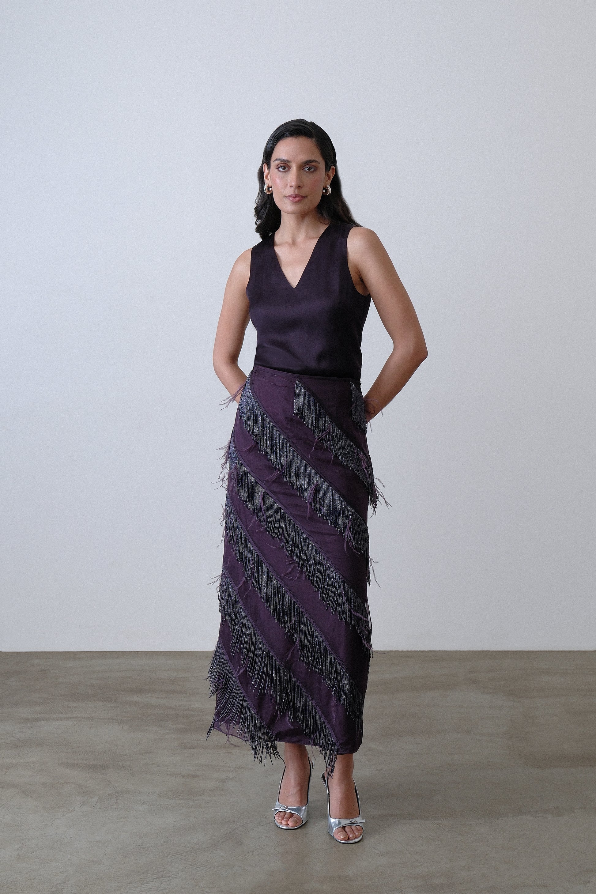 Deep plum organza and satin layered skirt with beaded fringe and feather detail