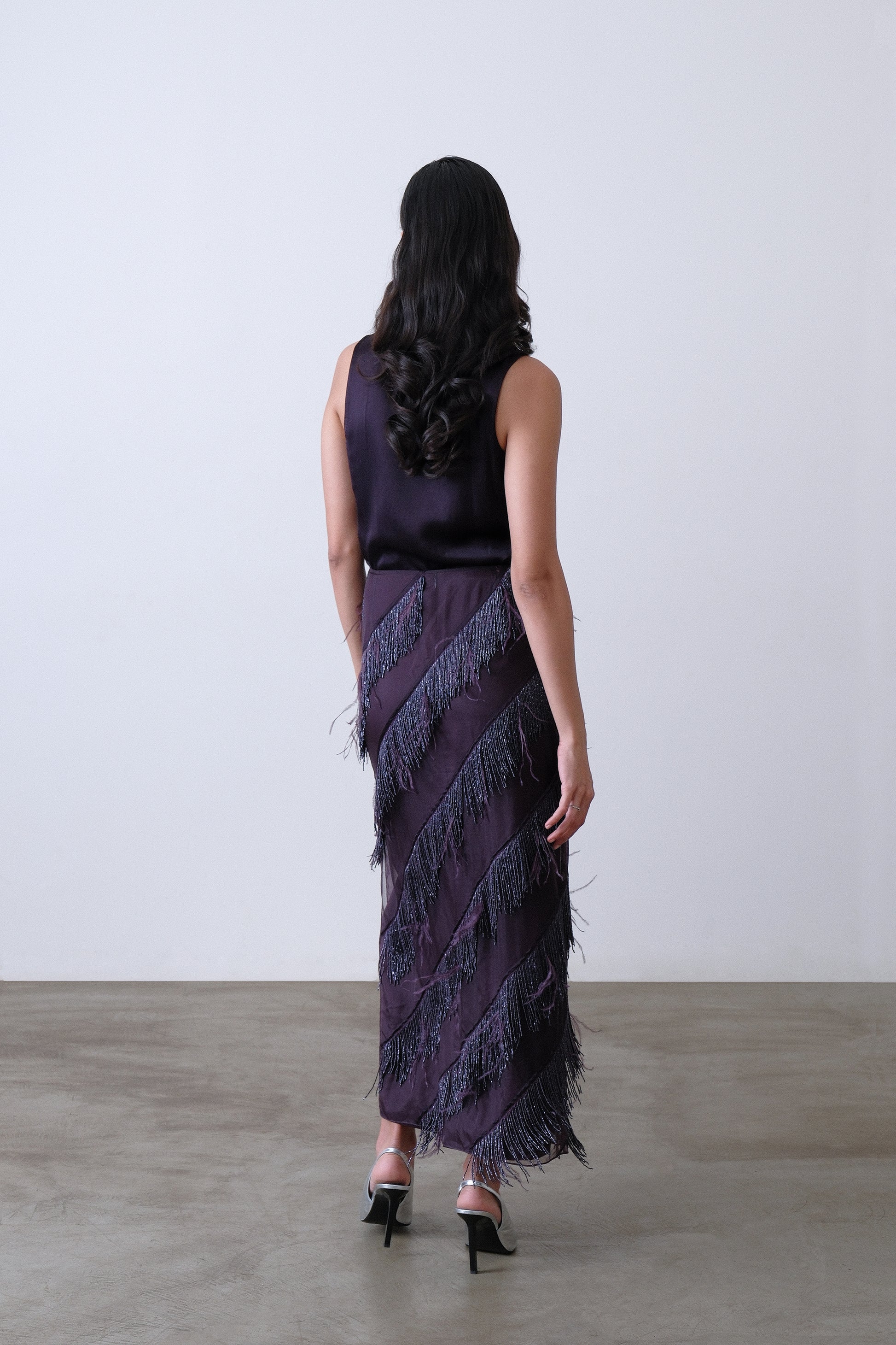 Deep plum layered skirt, back view with organza overlay and feather detail