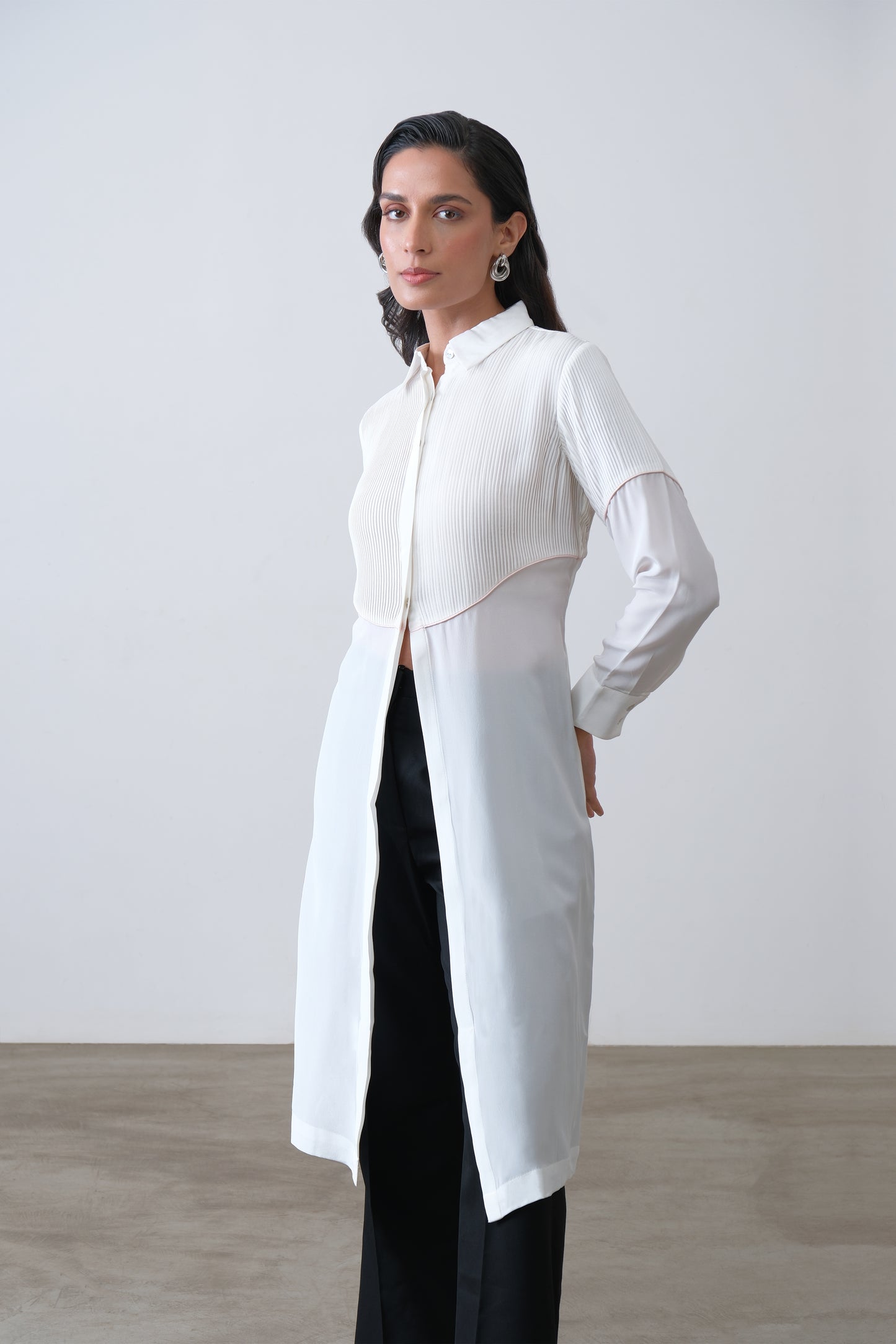 Off white silk crepe longline shirt with hand tucks, pink piping and front slit