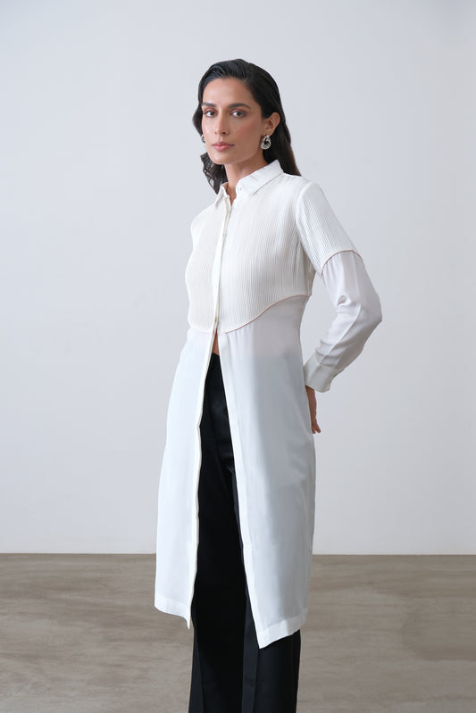 Off white silk crepe longline shirt with hand tucks, pink piping and front slit