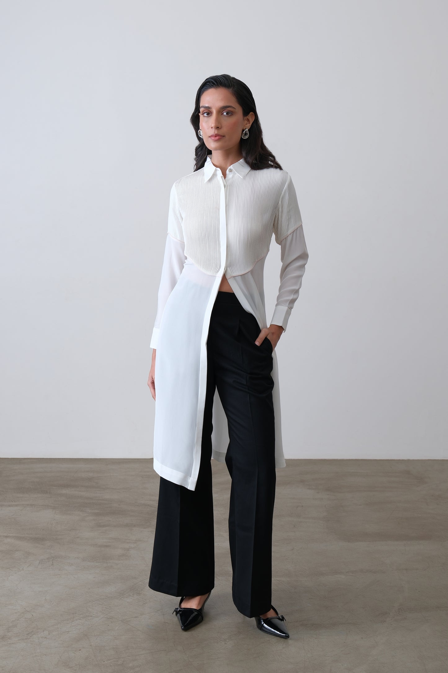Off white silk crepe longline shirt with hand tucks, pink piping and front slit