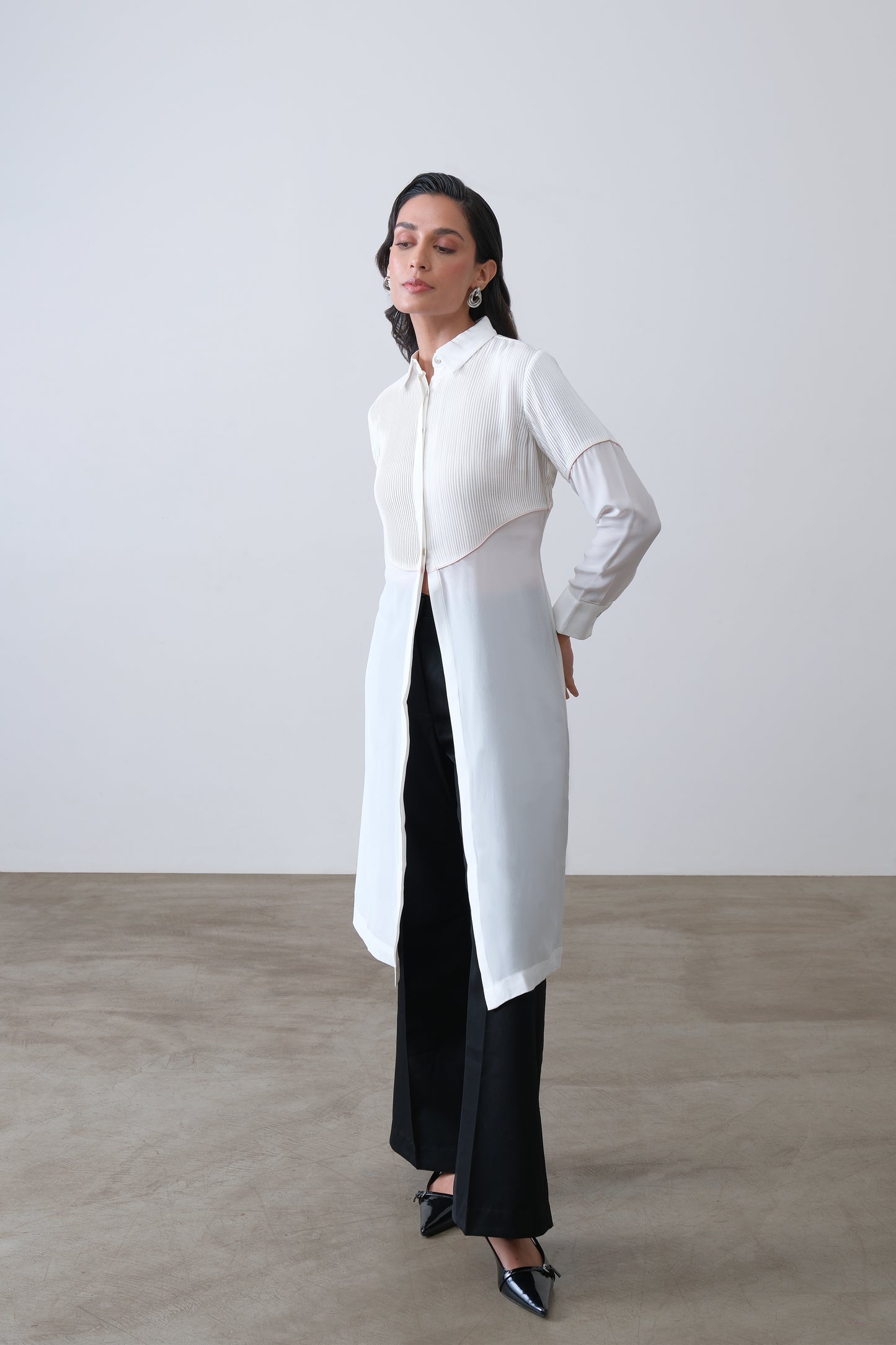 Off white silk crepe longline shirt with hand tucks, pink piping and front slit