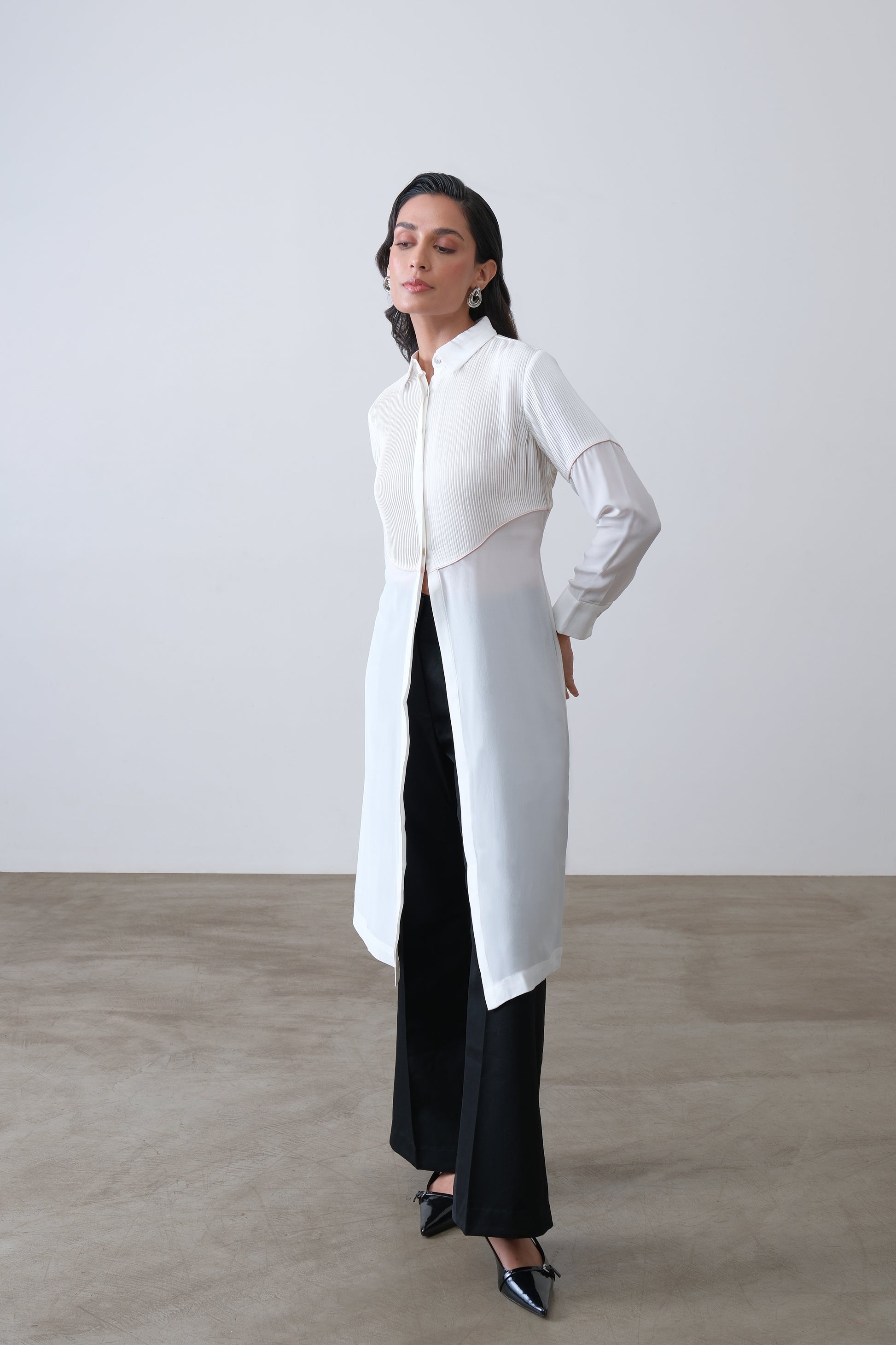 Off white silk crepe longline shirt with hand tucks, pink piping and front slit