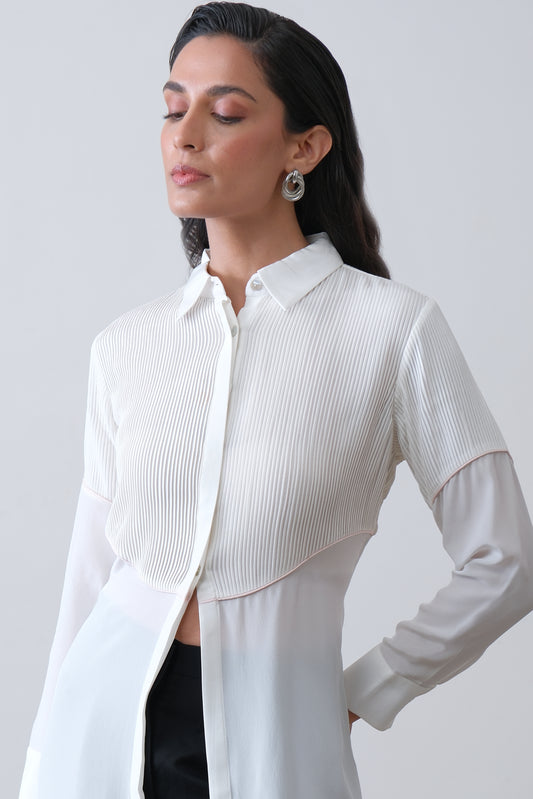 Close up of hand tucks and pink piping on off white silk crepe shirt