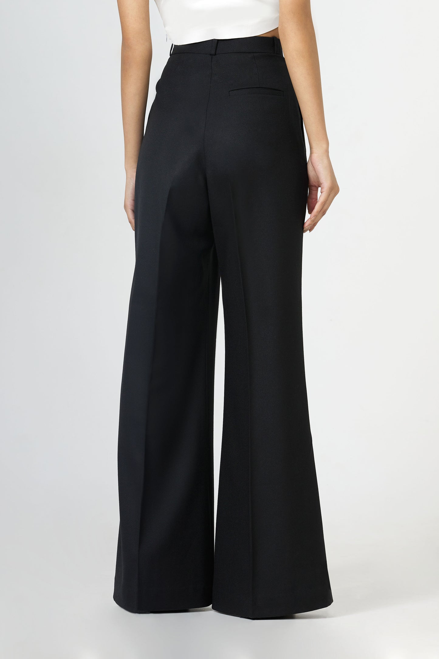 black front-pleated flared trousers
