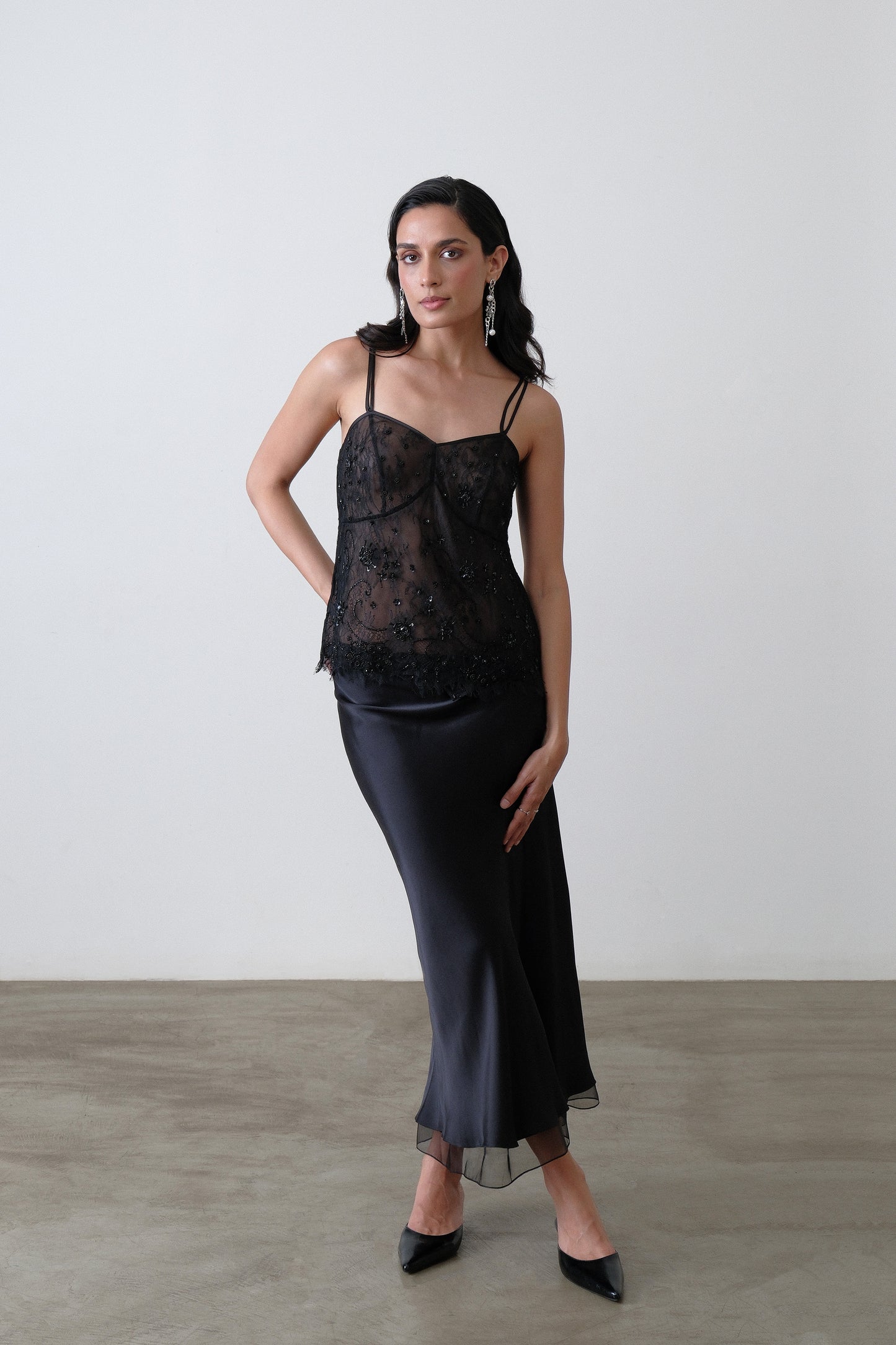 Black silk satin bias skirt with silk organza hem detail