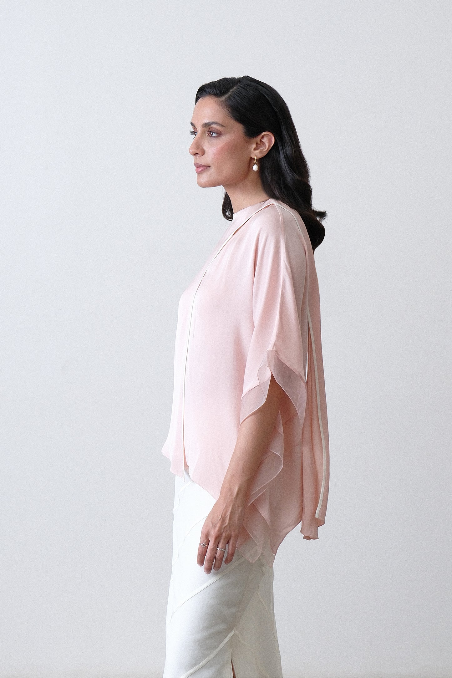 Side view of blush pink silk satin georgette top with kaftan inspired sleeve