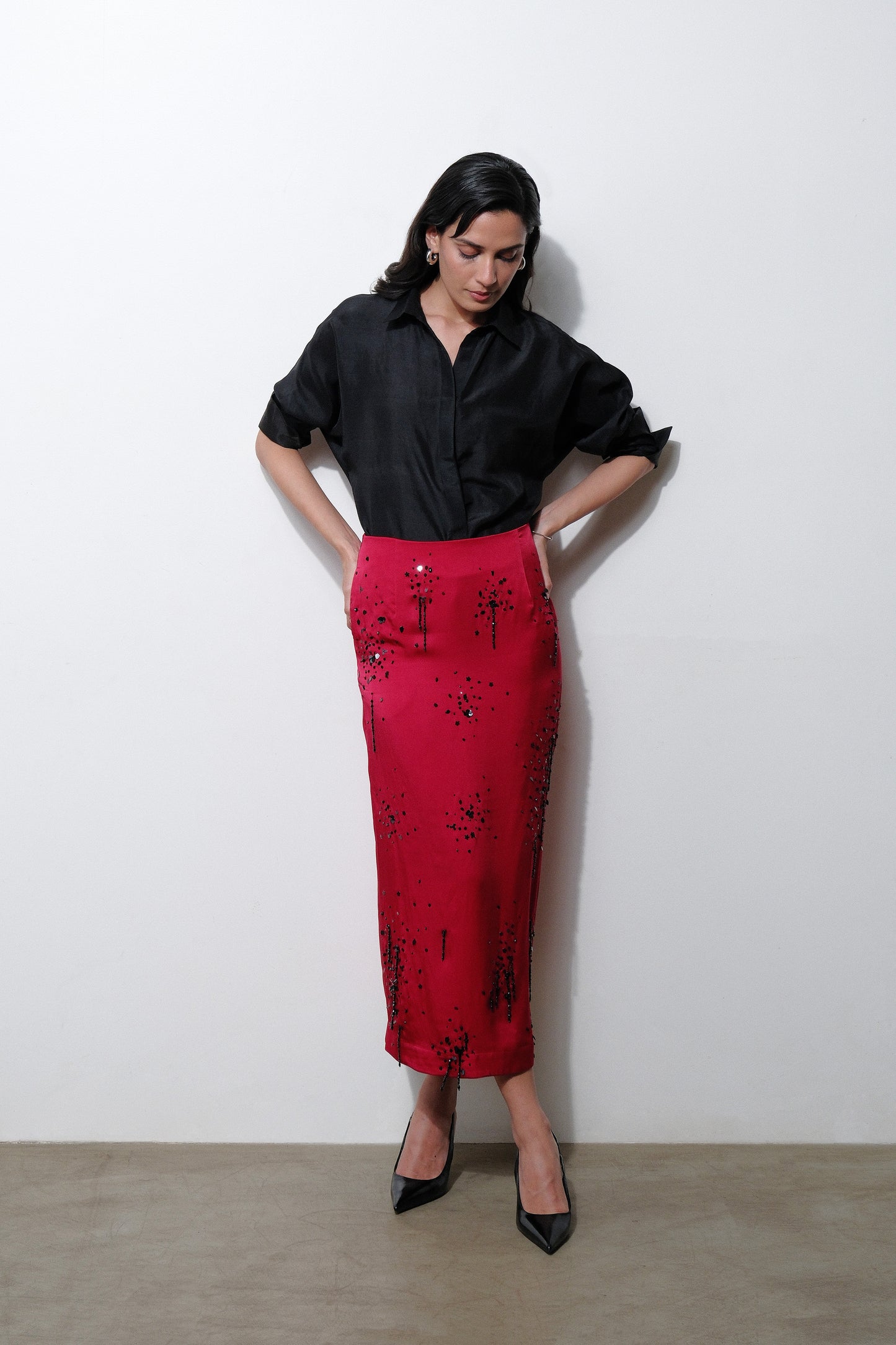 Dark red silk satin georgette midi skirt with hand embroidered black detail and tassels