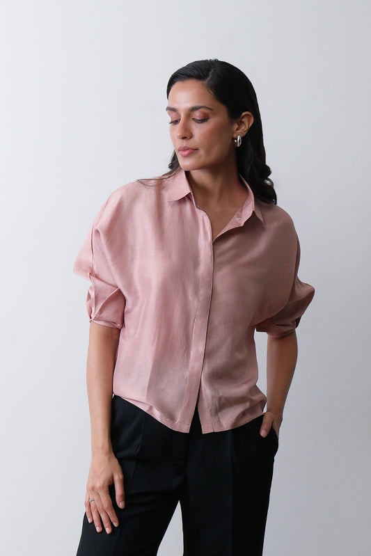 Close up of turned up cuff detail on dusty pink dupion silk shirt