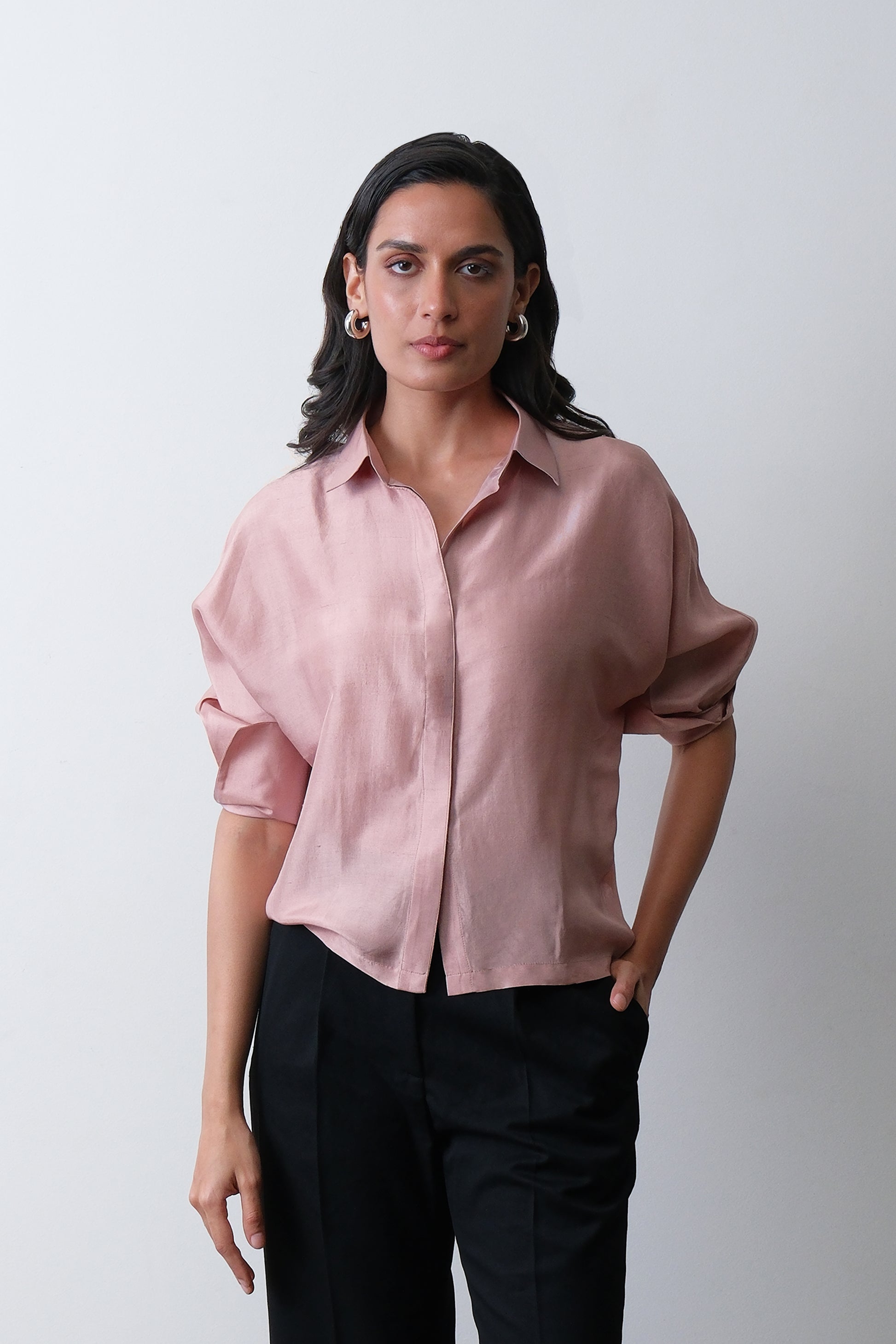 Close up of turned up cuff detail on dusty pink dupion silk shirt
