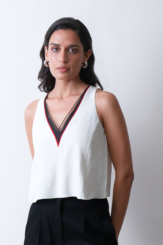 Ivory silk crepe top with organza neckline and red piping detail